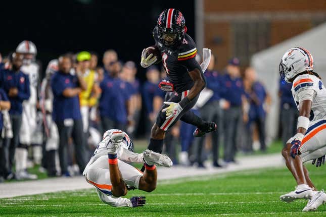 Sep 15, 2023; College Park, Maryland, USA; Maryland Terrapins wide receiver Shaleak Knotts (4) is tackled during the second quarter against the Virginia Cavaliers at SECU Stadium.