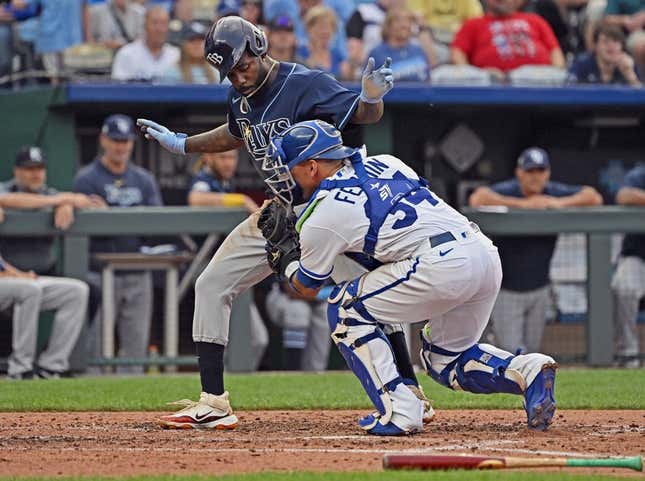 Jul 15, 2023; Kansas City, Missouri, USA;  Kansas City Royals catcher Freddy Fermin (34) tags out Tampa Bay Rays left fielder Randy Arozarena (56) at home plate in the sixth inning at Kauffman Stadium.