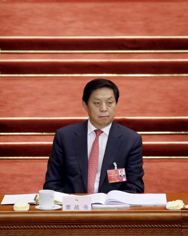 FILE PHOTO - Li Zhanshu, Director of the General Office of the Communist Party of China's Central Committee, attends the opening session of the National People's Congress (NPC) in Beijing, China, March 5, 2016. REUTERS/Jason Lee/File Photo - RC1C5D10CAE0