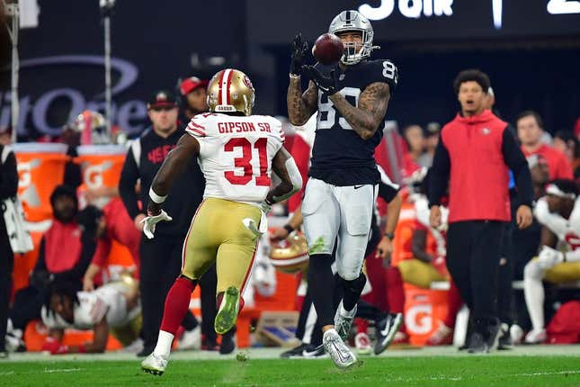 January 1, 2023; Paradise, Nevada, USA; Las Vegas Raiders tight end Darren Waller (83) catches a pass against San Francisco 49ers safety Tashaun Gipson Sr. (31) during the second half at Allegiant Stadium.