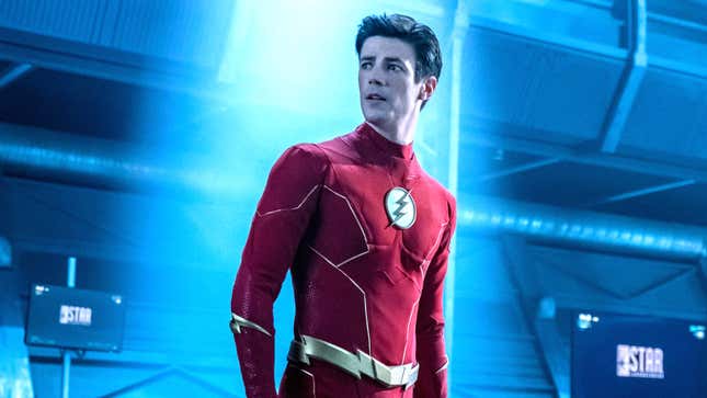 The maskless Flash looks pensively to his right in a blue hallway.
