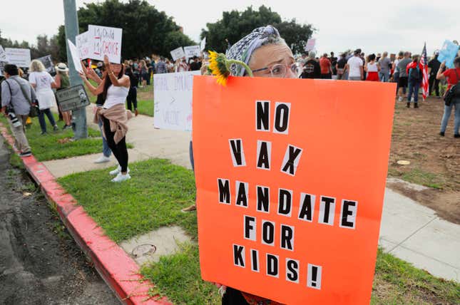 Anti-vaccine protesters stage a protest outside of the San Diego Unified School District office to protest a forced vaccination mandate for students on September 28, 2021 in San Diego, California. 