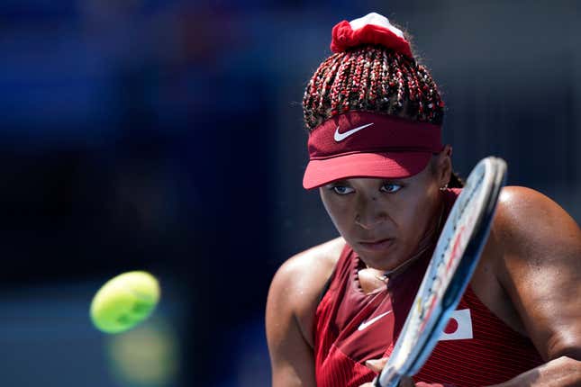 Naomi Osaka, of Japan, plays against Saisai Zheng, of China, during the first round of the tennis competition at the 2020 Summer Olympics, Sunday, July 25, 2021, in Tokyo, Japan.