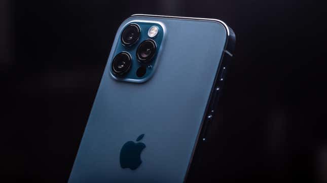 A blue iPhone 14 isolated on a black background