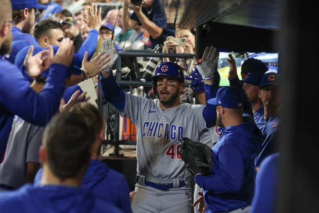 Aug 8, 2023; New York City, New York, USA; Chicago Cubs center fielder Mike Tauchman (40) celebrates with teammates after his solo home run during the eighth inning against the New York Mets at Citi Field.