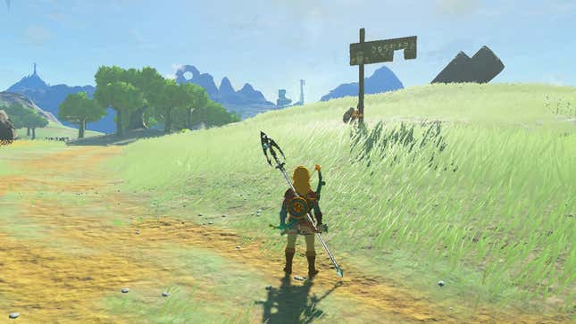 Addison struggles to hold up a sign on the green rolling hills of Hyrule.