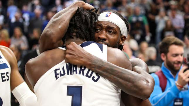 Patrick Beverley and Anthony Edwards of the Minnesota Timberwolves celebrate a 109-104 victory against the Los Angeles Clippers to advance to the NBA Playoffs.