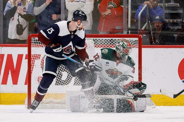 Mar 29, 2023; Denver, Colorado, USA; Colorado Avalanche right wing Valeri Nichushkin (13) deflects a shot in front of Minnesota Wild goaltender Filip Gustavsson (32) in the third period at Ball Arena.