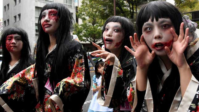 Young women wear traditional Japanese garb and zombie makeup.