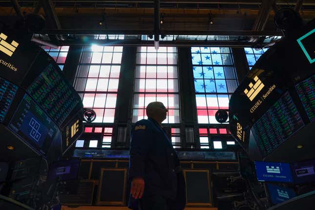 FILE - Traders work on the floor at the New York Stock Exchange in New York, Friday, July 1, 2022. (AP Photo/Seth Wenig, File)