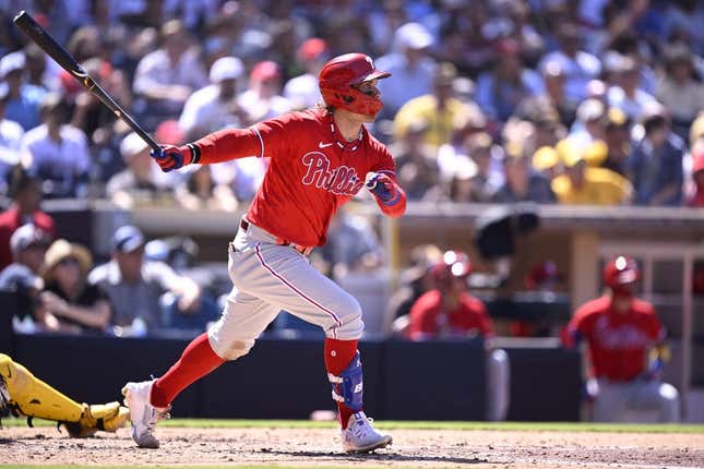 Sep 6, 2023; San Diego, California, USA; Philadelphia Phillies first baseman Bryce Harper (3) hits a two-RBI double against the San Diego Padres during the fourth inning at Petco Park.