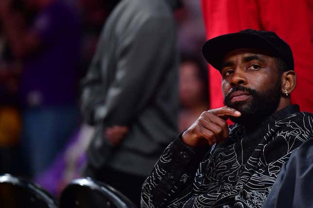 May 22, 2023; Los Angeles, California, USA; American professional basketball player Kyrie Irving watches from the baseline during the second quarter between the Los Angeles Lakers and the Denver Nuggets in game four of the Western Conference Finals for the 2023 NBA playoffs at Crypto.com Arena.