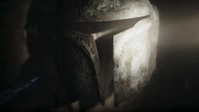 a dusty mandalorian helmet