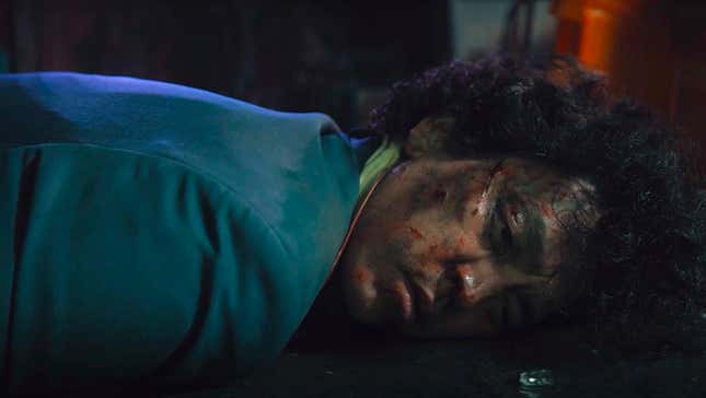His face dirty and bloody, Spike Spiegel (John Cho) lies on the ground after a long hard season.