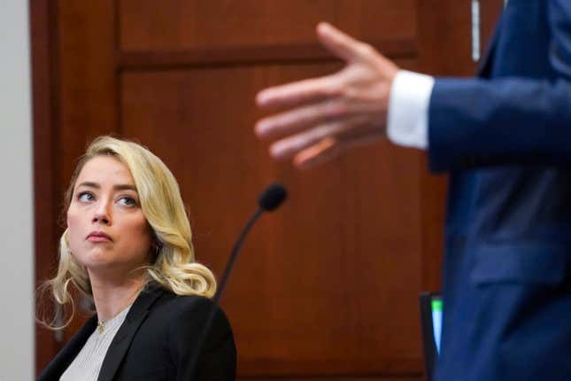 Actor Amber Heard listens in the courtroom at the Fairfax County Circuit Courthouse in Fairfax, Va., Wednesday, May 18, 2022.