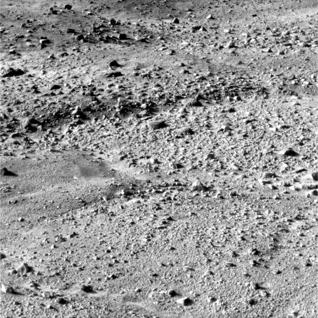 A black-and-white image of the rocky surface of Mars