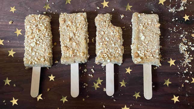 Frozen Custard Banana Pudding Cake Pops on wooden surface surrounded by stars
