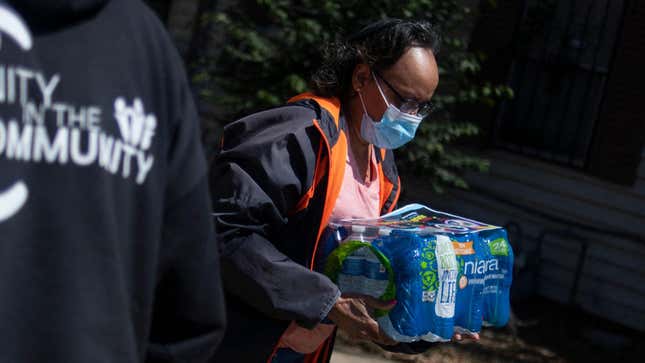 Operation Good hands out cases of water to residents in Jackson, Mississippi, on March 24, 2022. 