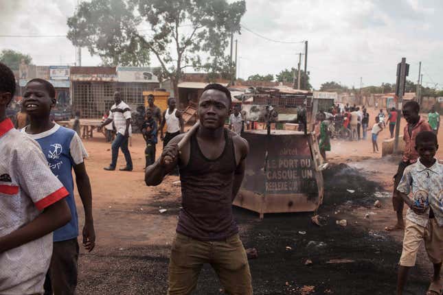 Anti-coup protesters among the burnt remains of tires in Ouagadougou.