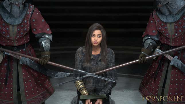 Frey sits bound on her knees in handcuffs with two guards armed with spears to either side of her.