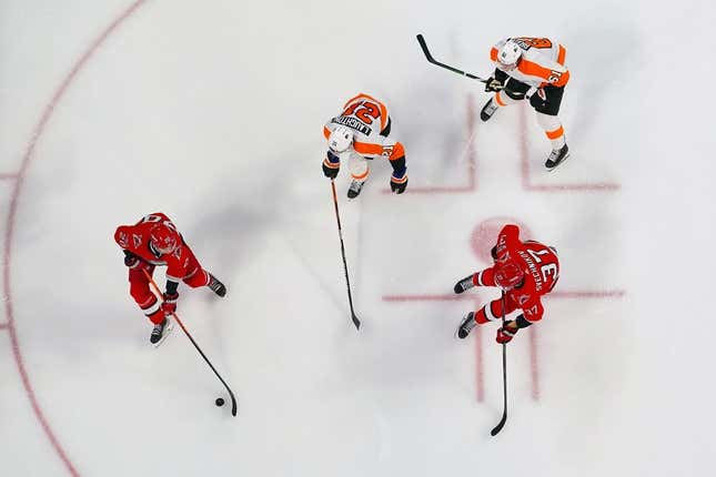 Mar 9, 2023; Raleigh, North Carolina, USA; Carolina Hurricanes center Sebastian Aho (20) with right wing Andrei Svechnikov (37) against Philadelphia Flyers center Scott Laughton (21) and defenseman Justin Braun (61) during the third period at PNC Arena.