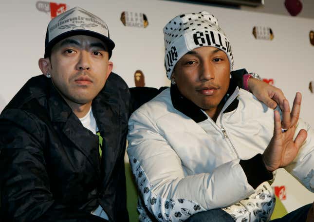 Hip-pop/R&B star Pharrell Williams of the Neptunes, right, and A Bathing Ape producer Nigo pose for photographers at a press conference to launch "Star Bape Search" audition to look for new Japanese artists in Tokyo, Japan, Monday, Feb. 18, 2008. (AP Photo/Shizuo Kambayashi)