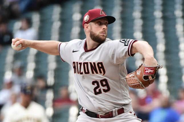 June 19, 2023;  Milwaukee, Wisconsin, USA;  Arizona Diamondbacks pitcher Merrill Kelly (29) pitches the first inning against the Milwaukee Brewers at American Family Field.