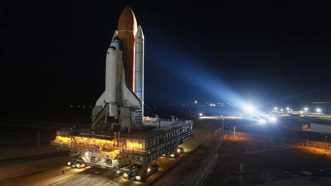 The Crawler carries a space shuttle to the launch pad 