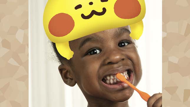 A kid brushes his teeth with an AR Pikachu hat on his head in Pokémon Smile.
