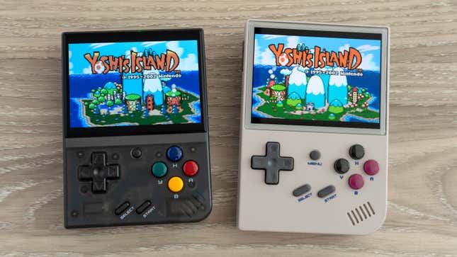 The Miyoo Mini Plus handheld next to the Anbernic RG35XX on a wooden table, with both featuring Yoshi's Island on screen.