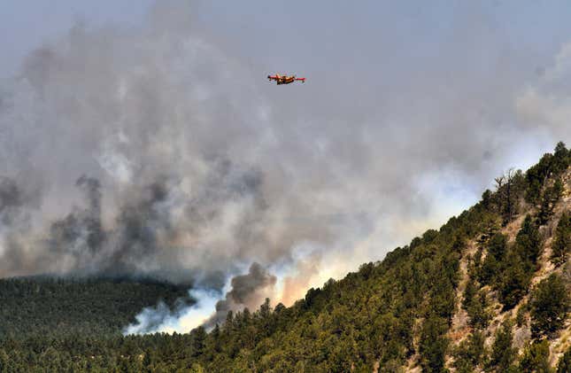 A firefighting plane flew over the fire near Las Vegas, NM on May 4.