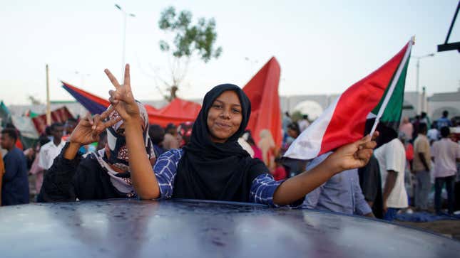 People chant slogans during a protest outside of the Military headquarters in Khartoum, Sudan, 13 April 2019. According to reports, thousands of Sudanese people demonstrated in front of the Military headquarters in Khartoum demanding that former President Omar al-Bashir face trial, as well as the military-led transitional council. Sudanese defense minister and head of Sudan's military council, Awad Ibn Auf, stepped down a day after leading a military coup that ousted long-time leader Omar al-Bashir amid a wave of protests. Awad Ibn Auf named Lt. Gen. Abdel Fattah Abdelrahman Burhan as his successor. A military-led transitional council will stay in power for two years followed by elections, the army said. Protests continue in Sudan, Khartoum - 13 Apr 2019