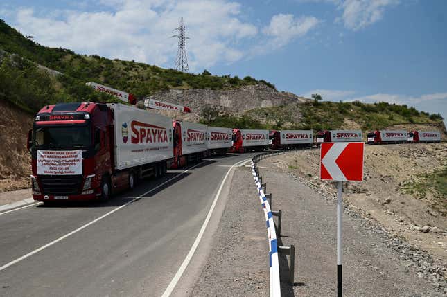 FILE - Trucks with humanitarian aid for Artsakh parked in a road towards the separatist region of Nagorno-Karabakh, in Armenia, on July 28, 2023. Armenia called on the U.N. Security Council to hold an emergency meeting on the worsening humanitarian situation in Azerbaijan’s Nagorno-Karabakh region, which is mostly populated by Armenians. In his letter to the president of the U.N. Security Council, sent Friday and released by Armenia’s Foreign Ministry on Saturday Aug. 12, 2023, Armenian U.N. ambassador Mher Margaryan said the people of Nagorno-Karabakh were “on the verge of a full-fledged humanitarian catastrophe.” (Hayk Manukyan/PHOTOLURE via AP, File)