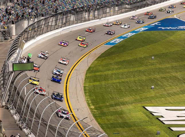 The green flag is being waved to start the 2023 Rolex 24 at Daytona.
