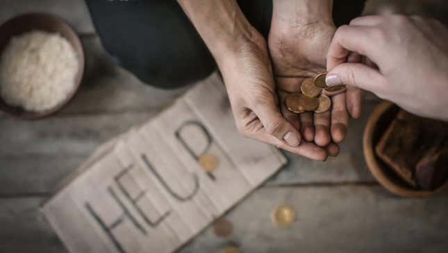 A beggar recieving a coin. 