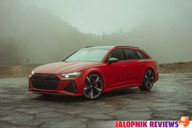 The 2022 Audi RS 6 wagon is parked in fog on broken pavement.