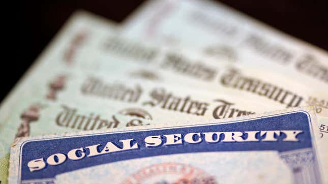 Half of a social security card is shown. Three checks from the U.S. Treasury are partly shown in the background.