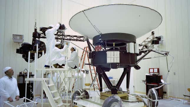 An image showing engineers working on the Voyager probe. 