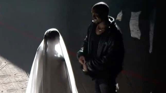 Image for article titled Trolling With the Kardashians? Kanye and Kim Seemingly Reenact Wedding at Chicago Donda Event