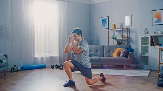 man doing lunges in his living room