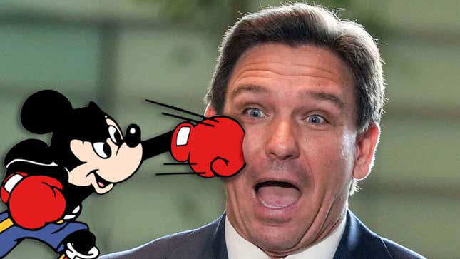 A cartoon Mickey Mouse punches Ron DeSantis in the face. 