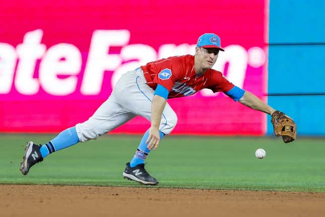 Apr 1, 2023; Miami, Florida, USA; Miami Marlins shortstop Joey Wendle (18) dives but cannot catch a base hit from New York Mets catcher Omar Narvaez (not pictured) during the eighth inning at loanDepot Park.