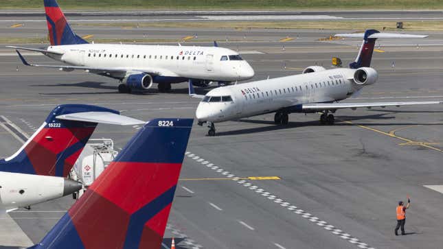 Delta planes on the tarmac at Terminal C of LaGuardia Airport (LGA) in the Queens borough of New York, US, on Friday, June 2, 2023. Delta Air Lines Inc.  is scheduled to release earnings figures on July 13. 