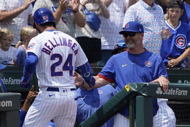 Jul 23, 2023; Chicago, Illinois, USA; Chicago Cubs center fielder Cody Bellinger (24) is greeted by Chicago Cubs manager David Ross (3) after hitting a two-run homer against the St. Louis Cardinals during the first inning at Wrigley Field.