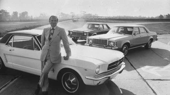 Ford Motor Co. President Lee A. Iacocca, leaning against a Ford Mustang.