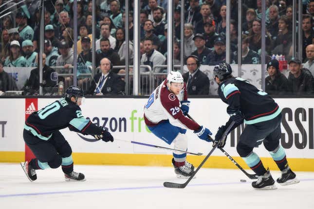 Apr 28, 2023; Seattle, Washington, USA; Colorado Avalanche center Nathan MacKinnon (29) advances the puck while guarded by Seattle Kraken defenseman Will Borgen (3) during the first half in game six of the first round of the 2023 Stanely Cup Playoffs at Climate Pledge Arena.