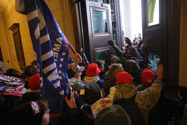WASHINGTON, DC - JANUARY 06: Protesters supporting U.S. President Donald Trump break into the U.S. Capitol on January 06, 2021 in Washington, DC. In the wake of the Jan. 6 attack, Joe Biden announced a new national plan to combat domestic terrorism. 