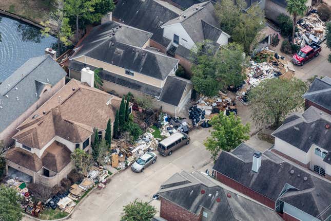 Floods rising out of Buffalo Bayou inundated entire blocks of houses in Briar Forest. About 30cm of water was enough to destroy floors, furniture and interior walls, all of which were hauled onto front yards for disposal.