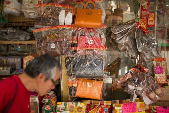 Luxury fashion brand Gucci has warned Hong Kong shops selling paper handbags as 'offerings' for the dead not to market items resembling their products. / AFP / AARON TAM (Photo credit should read AARON TAM/AFP/Getty Images)