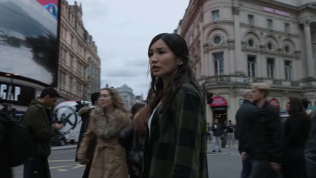 Gemma Chan's Sersi stands in the busy crosswalks of London's Piccadilly Circus in Marvel's Eternals.